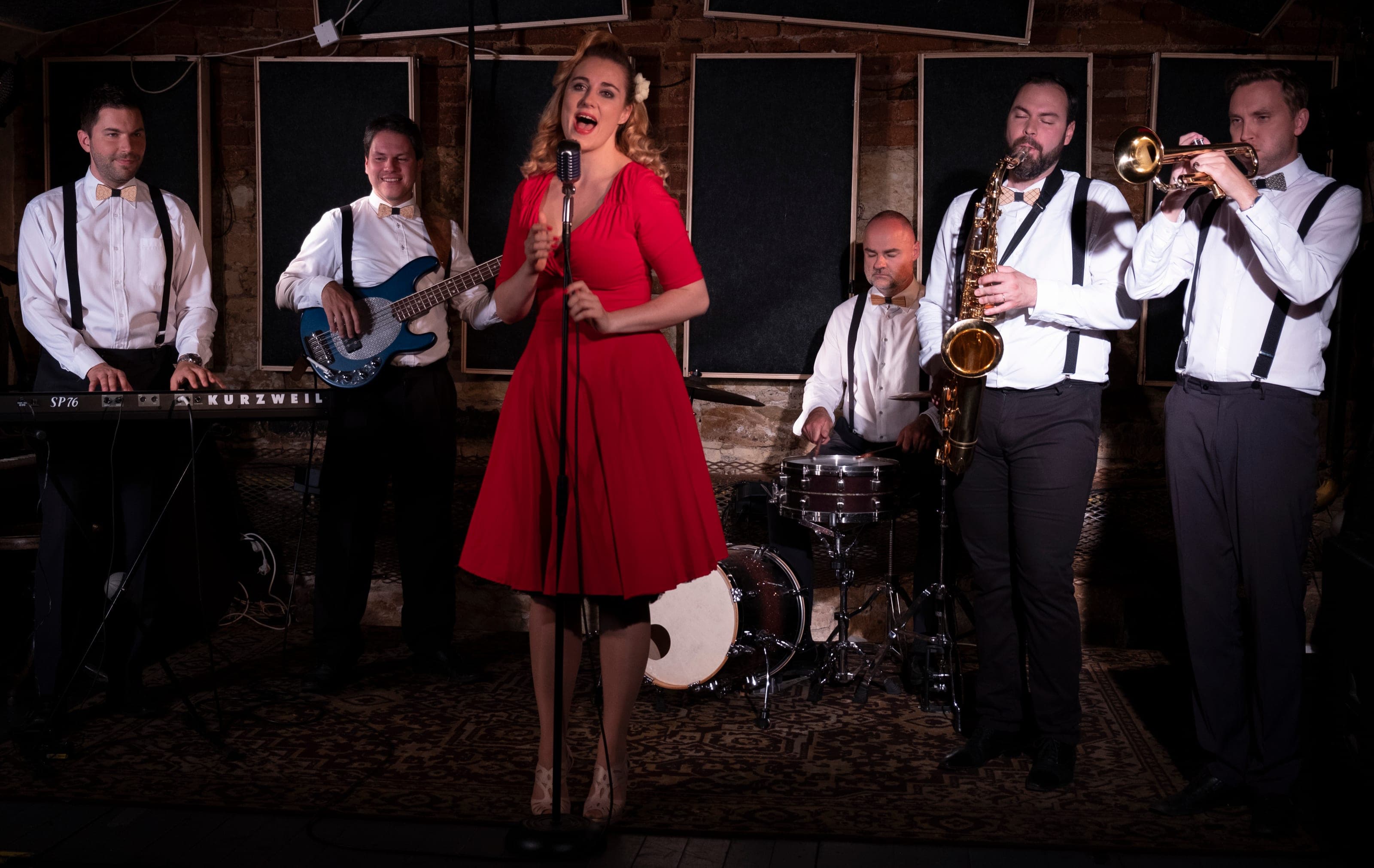 The full six-piece ROURA band performing