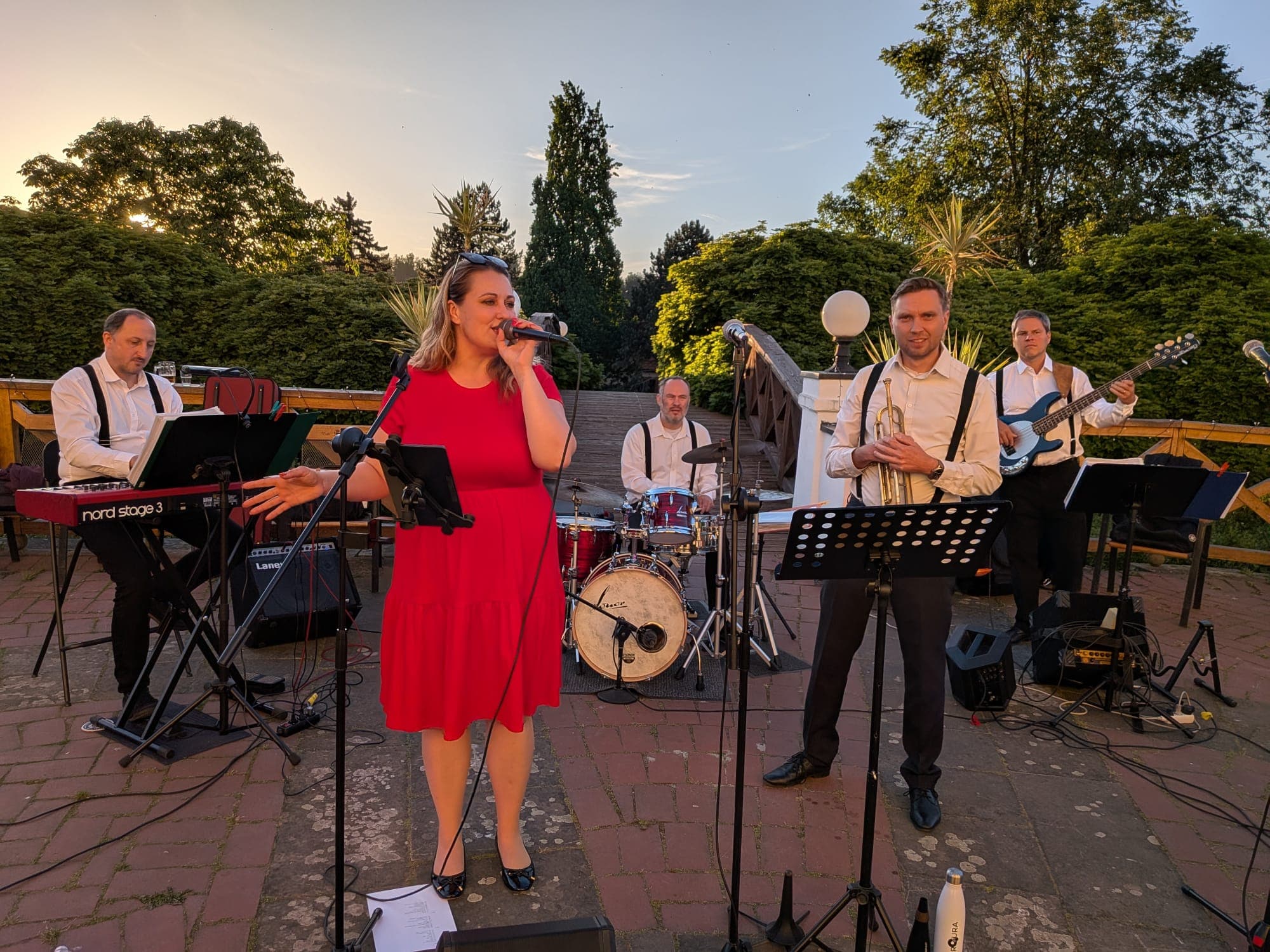 ROURA performing at an outdoor wedding in Pecínov